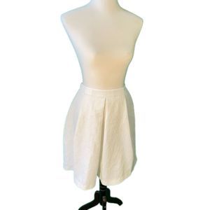 Textured white skirt with gold exposed zipper